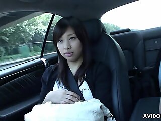 Japanese brunette Karin Asahi sucks dick in the car uncensored.